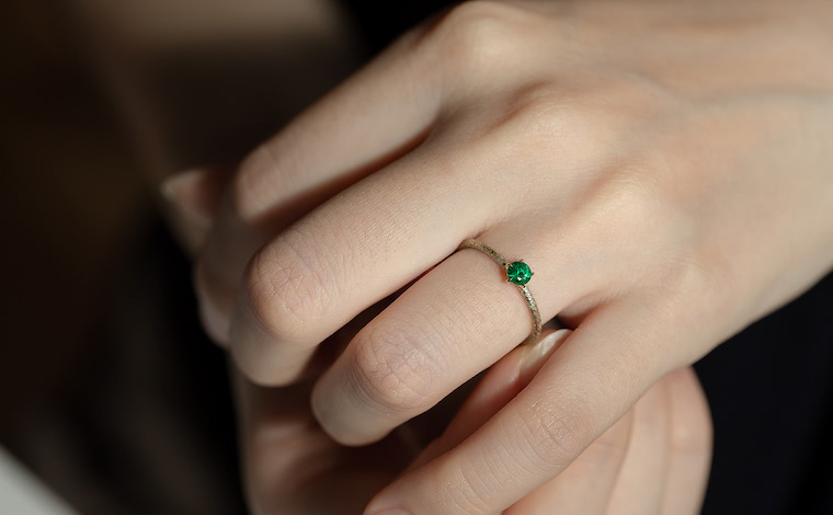 Emerald Stardust Ring worn on